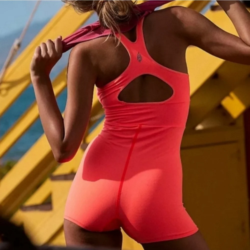 Free People Movement Every Single Time Runsie. NWTS Neon Coral sz M/L